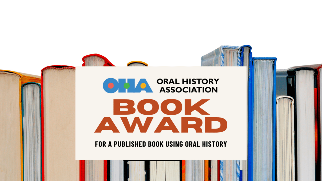 A row of colorful books stands upright behind a sign that reads: Oral History Association Book Award for a published book using oral history.