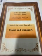 A booklet cover titled Lets go down Memory Lane Nostalgia Project and Reminiscence booklet Travel and transport, with decorative borders and an orange and cream color scheme.